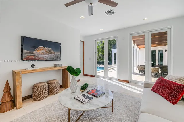 a living room with furniture and a rug