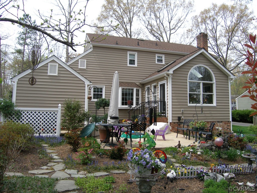 525 Watch Hill Road Midlothian, VA 23114 - Photo 3 of 24 a front view of a house with garden