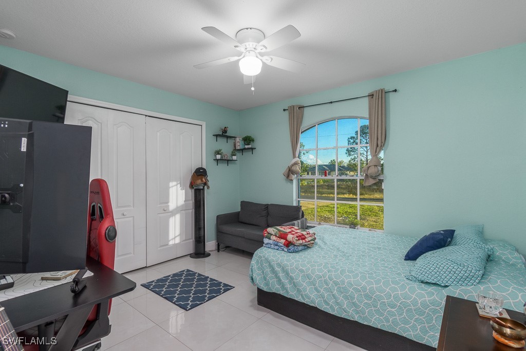 2808 9th Street Southwest Lehigh Acres, FL 33976 - Photo 13 of 34 a living room with furniture and a window