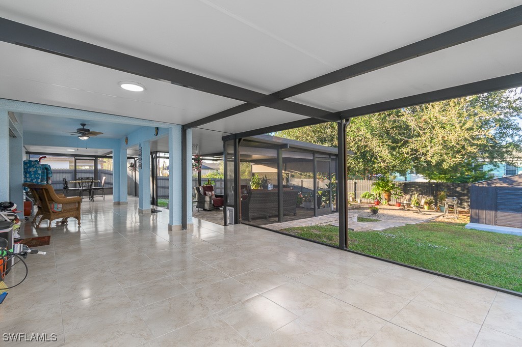 2808 9th Street Southwest Lehigh Acres, FL 33976 - Photo 14 of 34 a view of a hall with floor to ceiling windows and yard