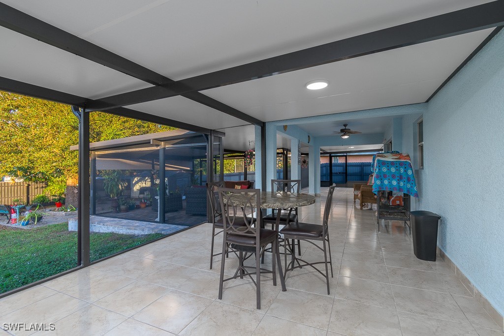 2808 9th Street Southwest Lehigh Acres, FL 33976 - Photo 16 of 34 a dining room with furniture and a garden