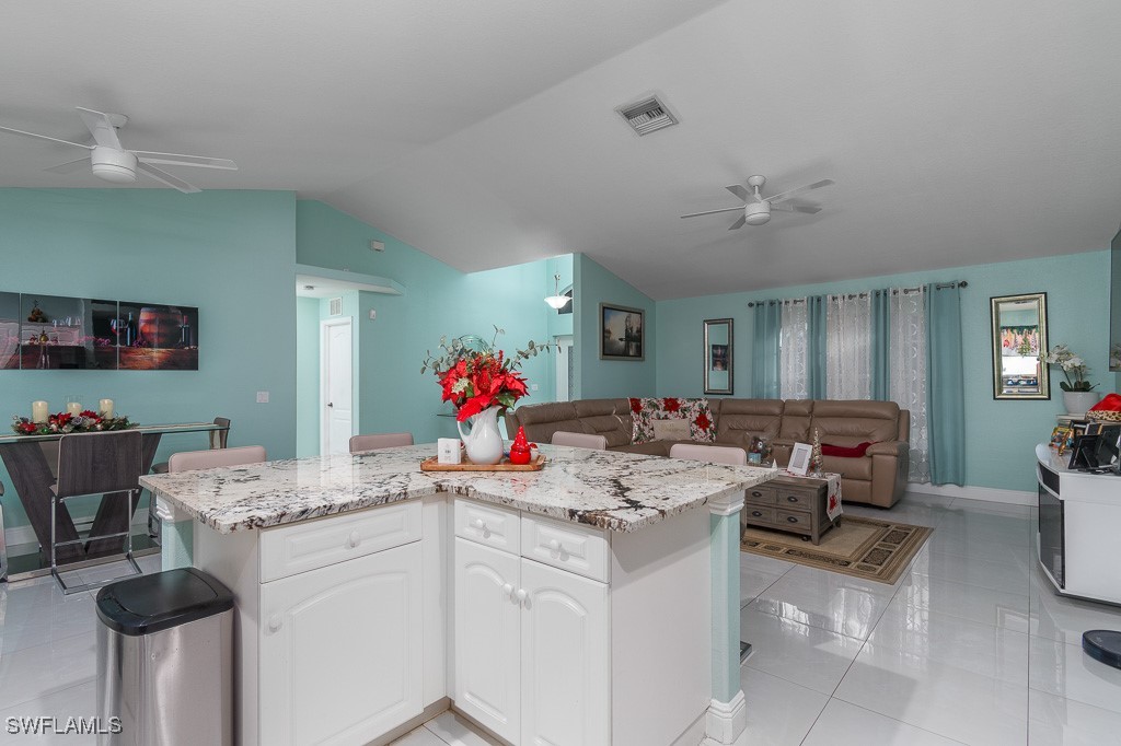 2808 9th Street Southwest Lehigh Acres, FL 33976 - Photo 2 of 34 a very nice looking dining room with a table and chairs