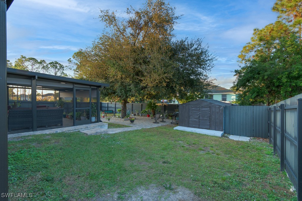 2808 9th Street Southwest Lehigh Acres, FL 33976 - Photo 27 of 34 a view of a back yard of the house