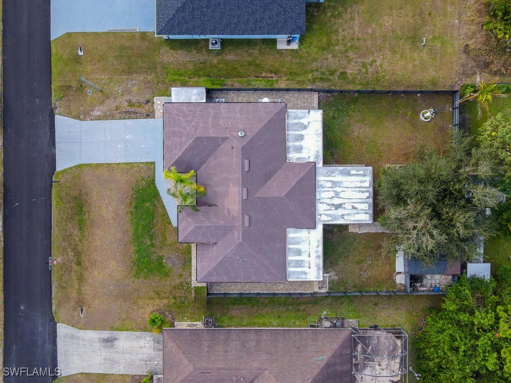 2808 9th Street Southwest Lehigh Acres, FL 33976 - Photo 34 of 34 an aerial view of a house with a yard