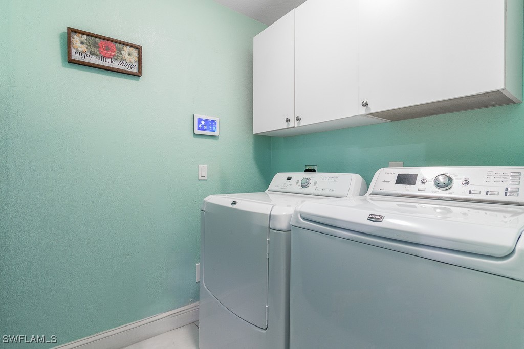 2808 9th Street Southwest Lehigh Acres, FL 33976 - Photo 10 of 34 a utility room with dryer and washer