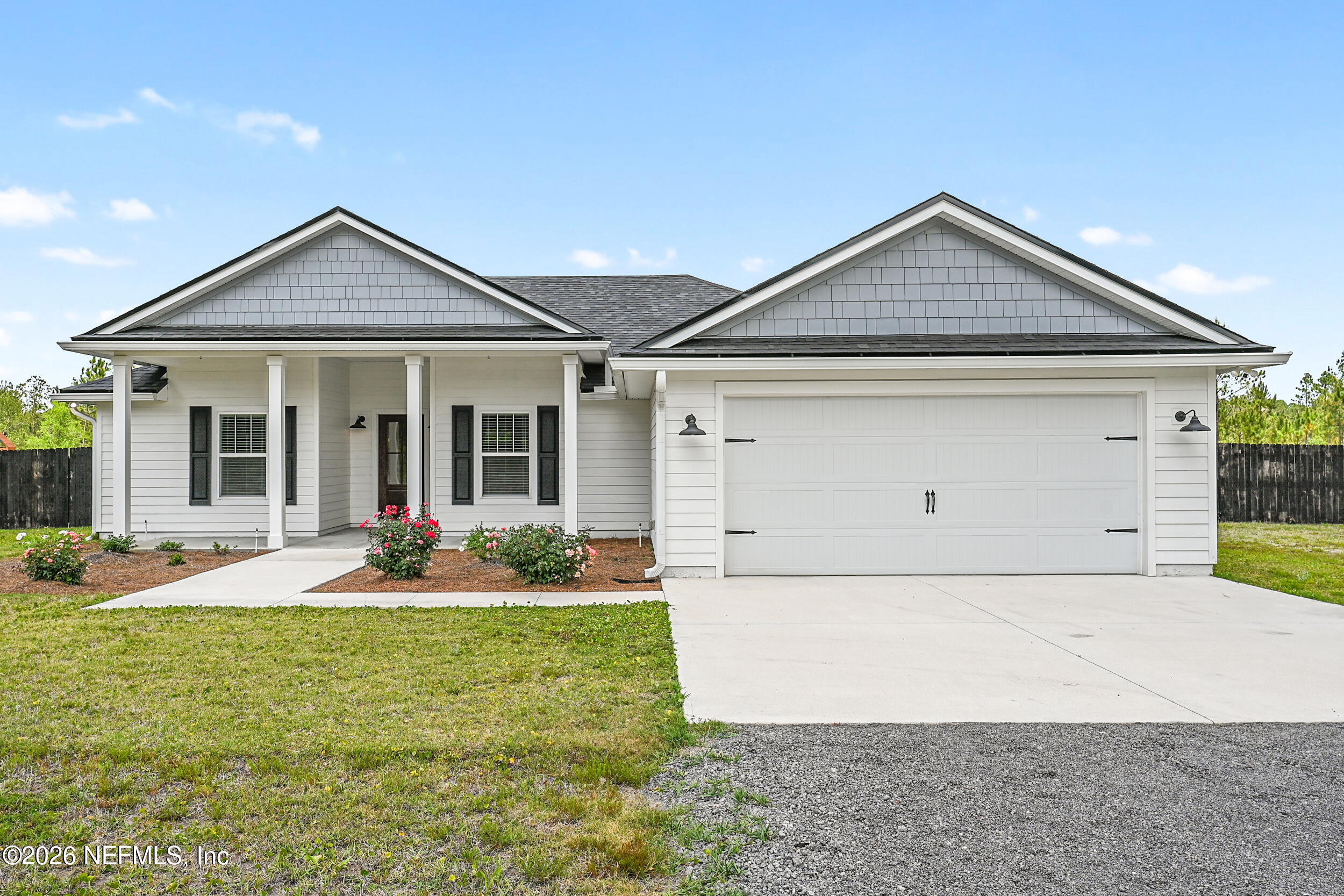 8685 Odis Yarborough Road Glen St. Mary, FL 32040 - Photo 1 of 59 a front view of a house with garden