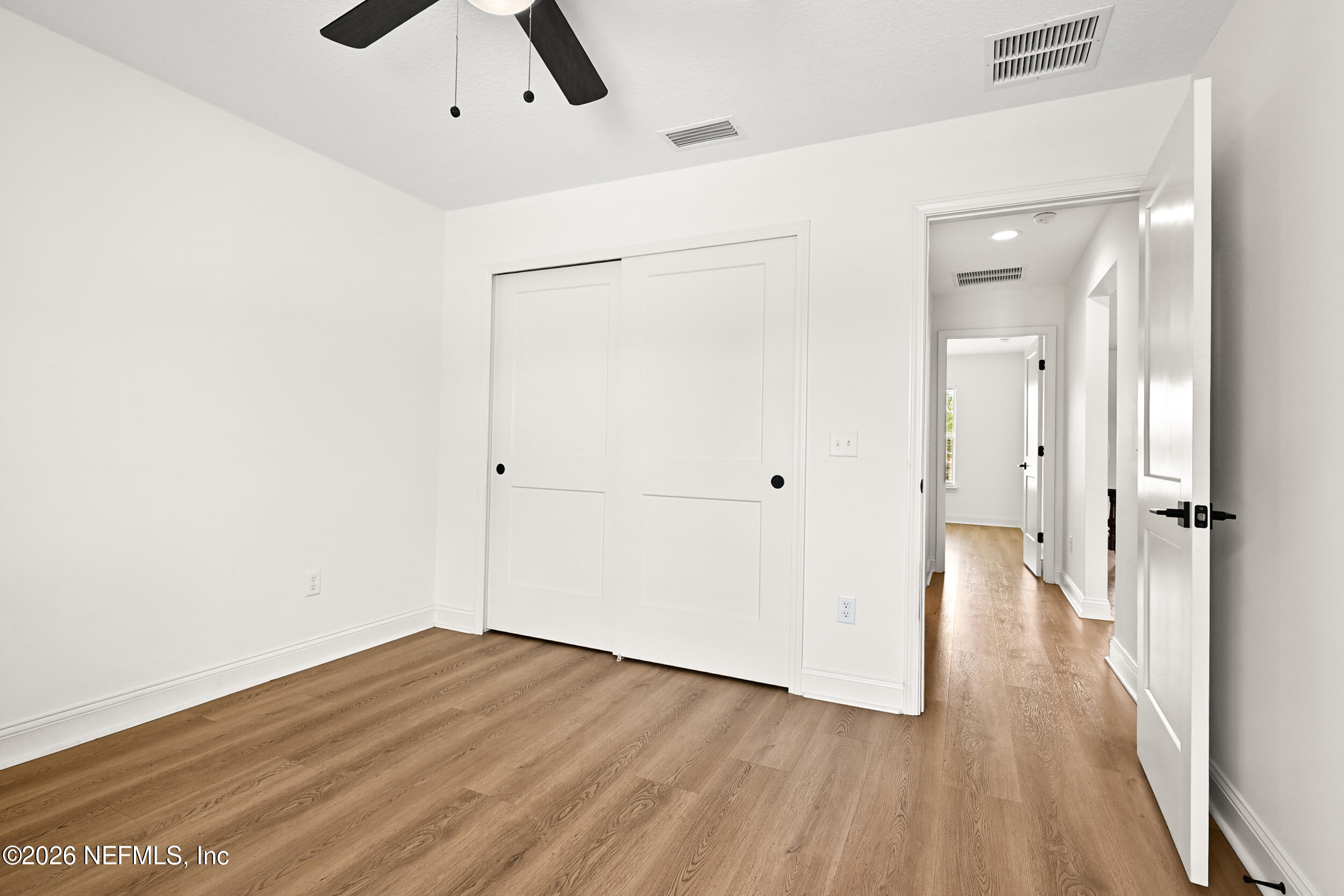 8685 Odis Yarborough Road Glen St. Mary, FL 32040 - Photo 32 of 59 wooden floor in an empty room