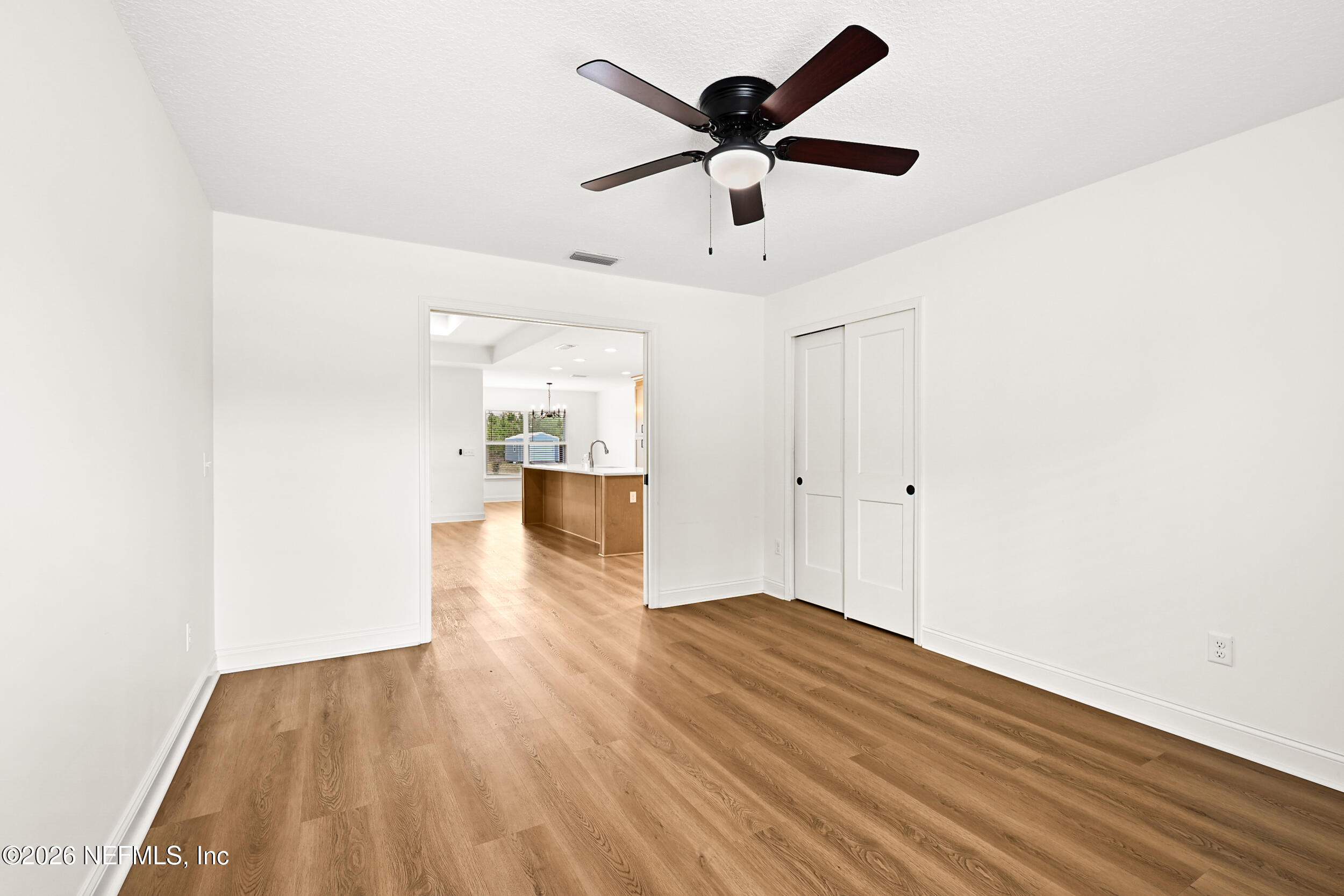 8685 Odis Yarborough Road Glen St. Mary, FL 32040 - Photo 40 of 59 a view of empty room with wooden floor and window