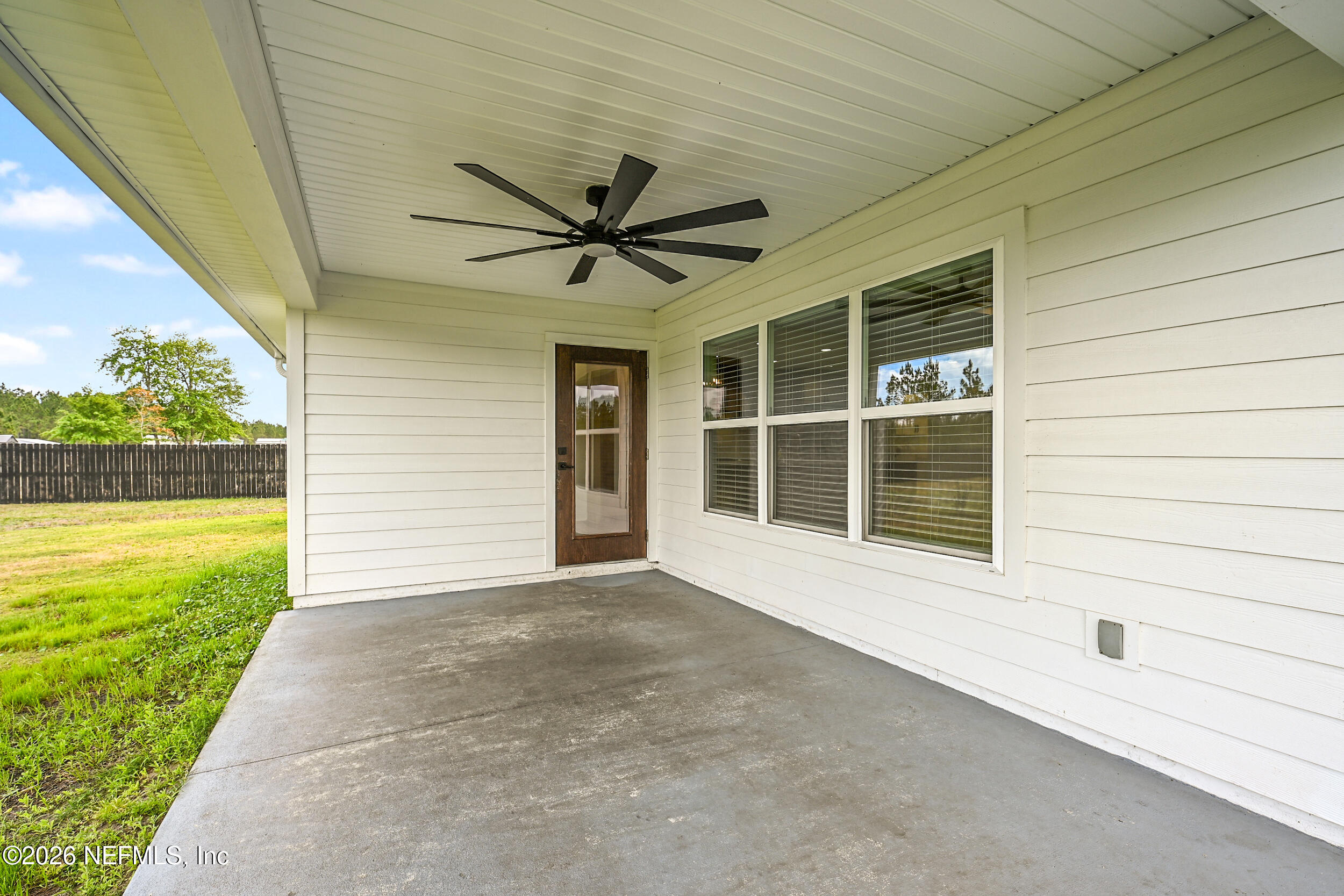 8685 Odis Yarborough Road Glen St. Mary, FL 32040 - Photo 46 of 59 a view of an empty room with a window and a ceiling fan