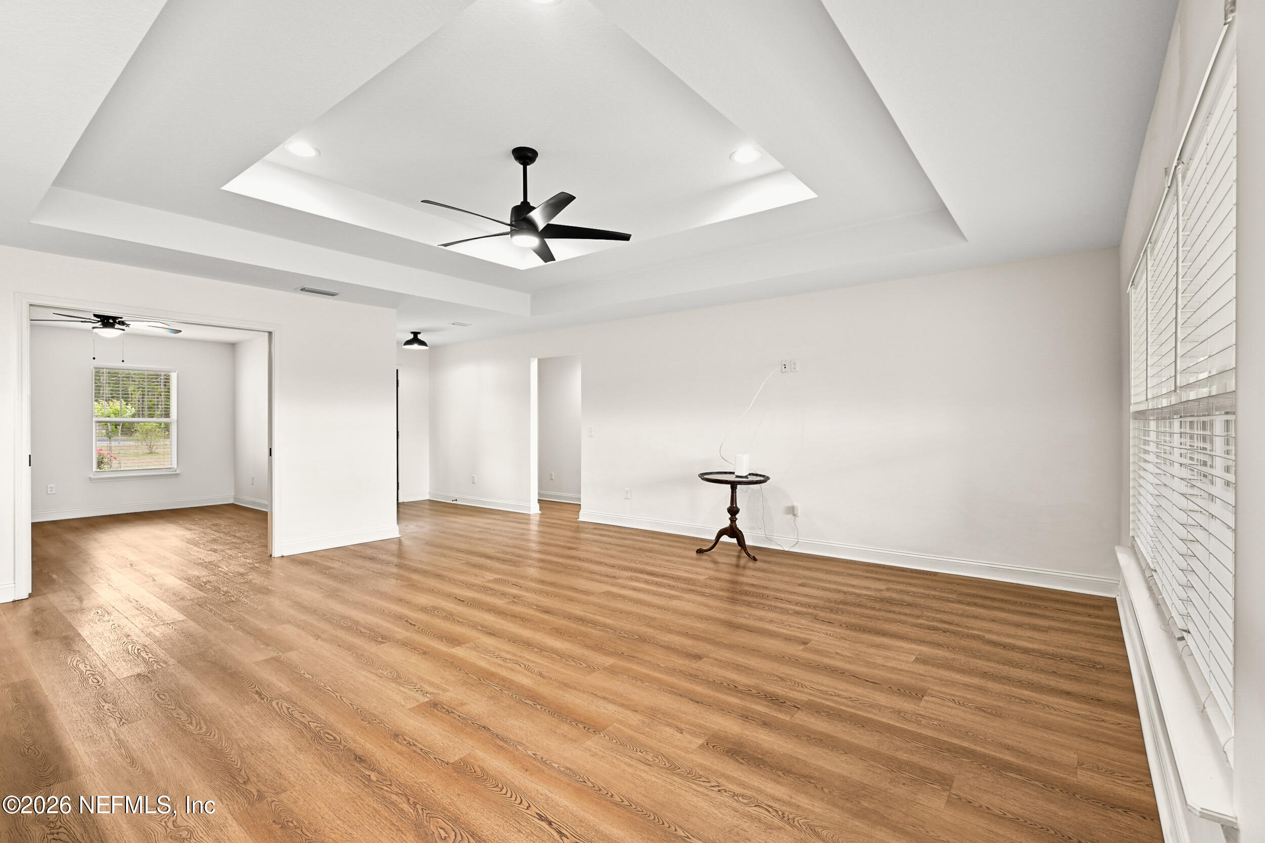 8685 Odis Yarborough Road Glen St. Mary, FL 32040 - Photo 7 of 59 a view of empty room with wooden floor and fan