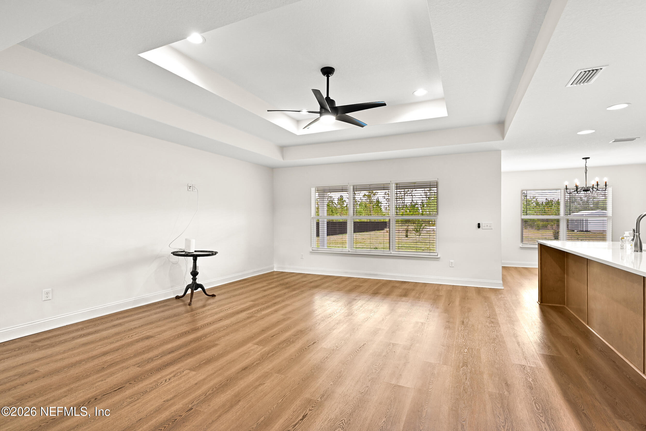 8685 Odis Yarborough Road Glen St. Mary, FL 32040 - Photo 8 of 59 a view of an empty room with a window and wooden floor