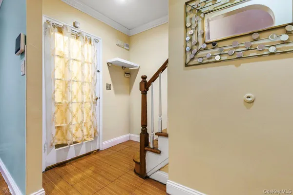 a view of a big room with wooden floor and a ceiling fan