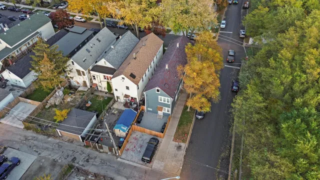 an aerial view of a house with outdoor space