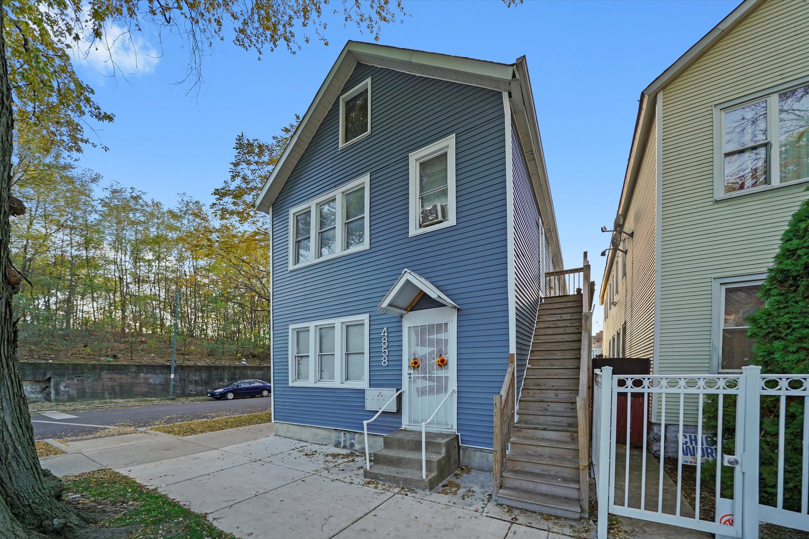 4858 South Justine Street Chicago, IL 60609 - Photo 2 of 20 a front view of a house with a yard