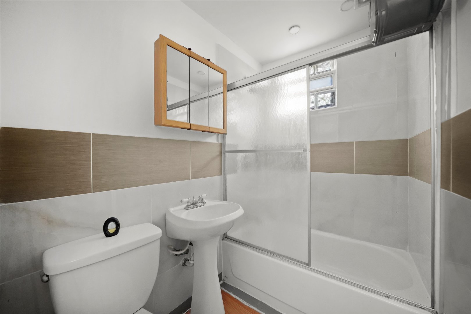 4858 South Justine Street Chicago, IL 60609 - Photo 6 of 20 a bathroom with a sink toilet and shower