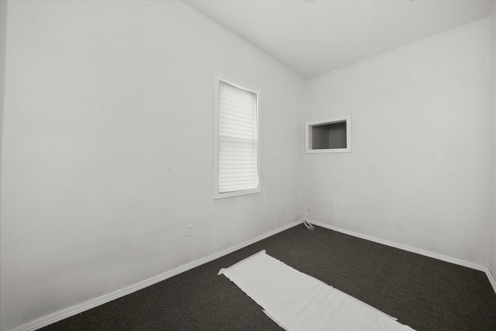 4858 South Justine Street Chicago, IL 60609 - Photo 8 of 20 an empty room with a window