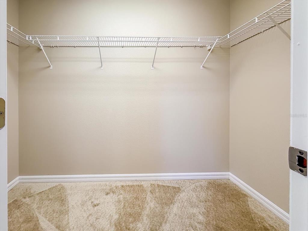 276 Longhirst Loop Ocoee, FL 34761 - Photo 26 of 60 a view of a room with racks on the wall