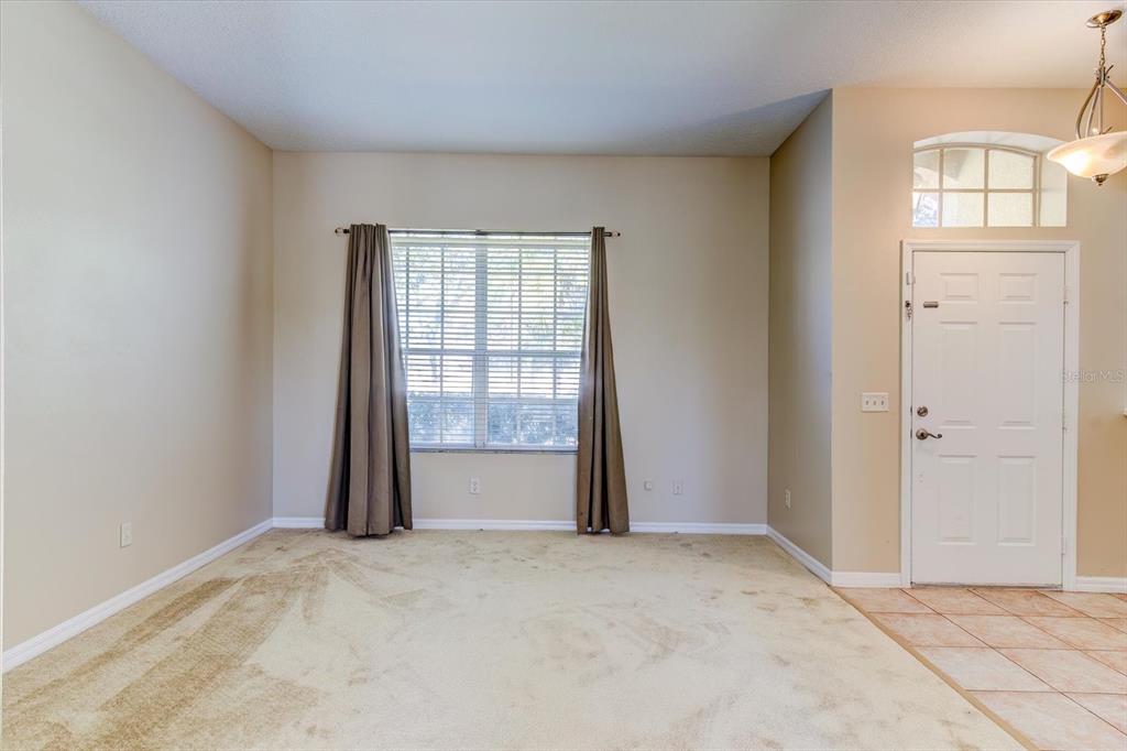 276 Longhirst Loop Ocoee, FL 34761 - Photo 5 of 60 a view of an empty room with a window