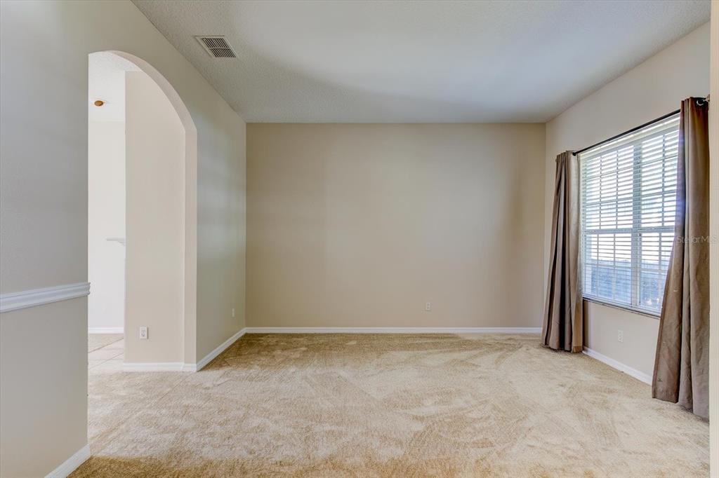 276 Longhirst Loop Ocoee, FL 34761 - Photo 7 of 60 a view of an empty room with a window