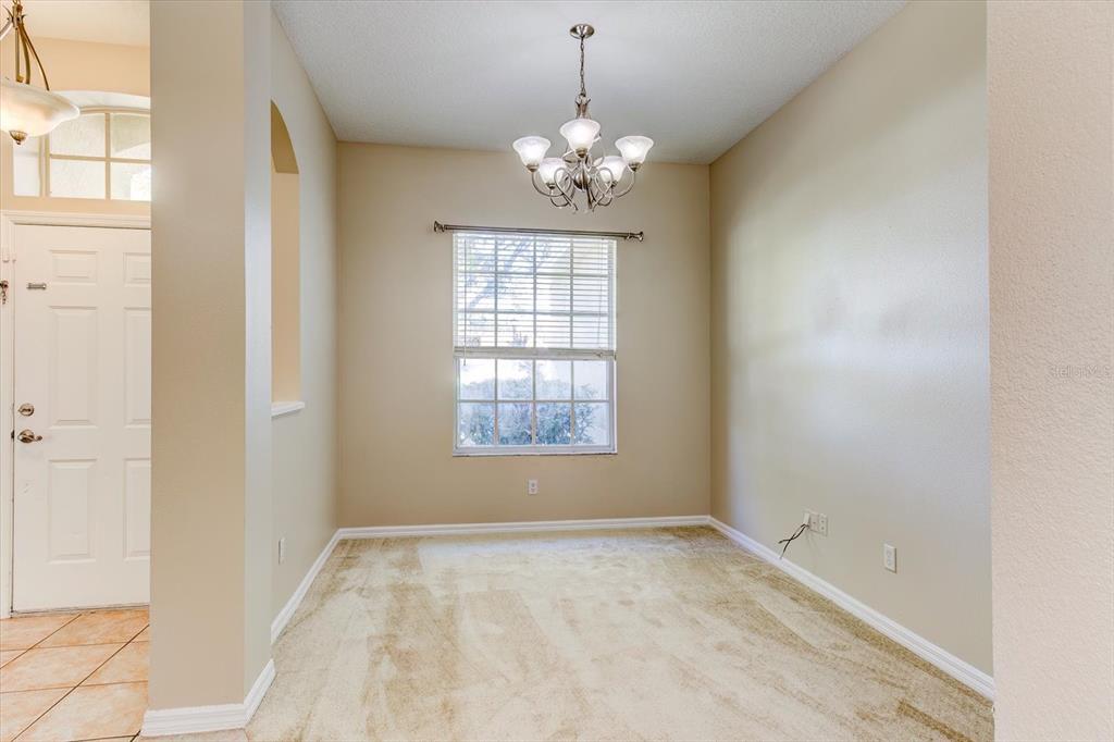 276 Longhirst Loop Ocoee, FL 34761 - Photo 8 of 60 a view of an empty room with a window