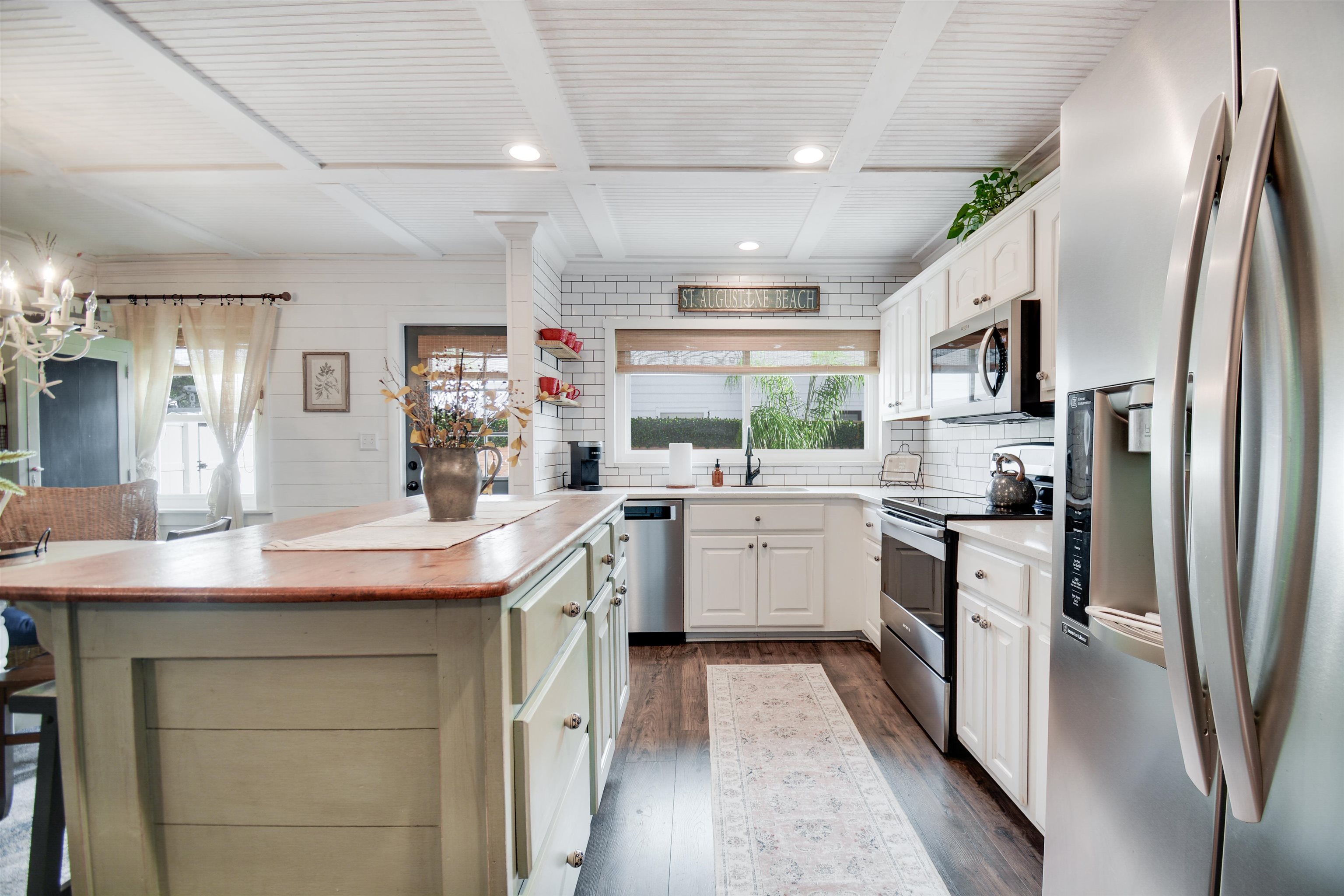 156 Egret Road St. Augustine, FL 32086 - Photo 11 of 44 a kitchen with white cabinets sink and stainless steel appliances