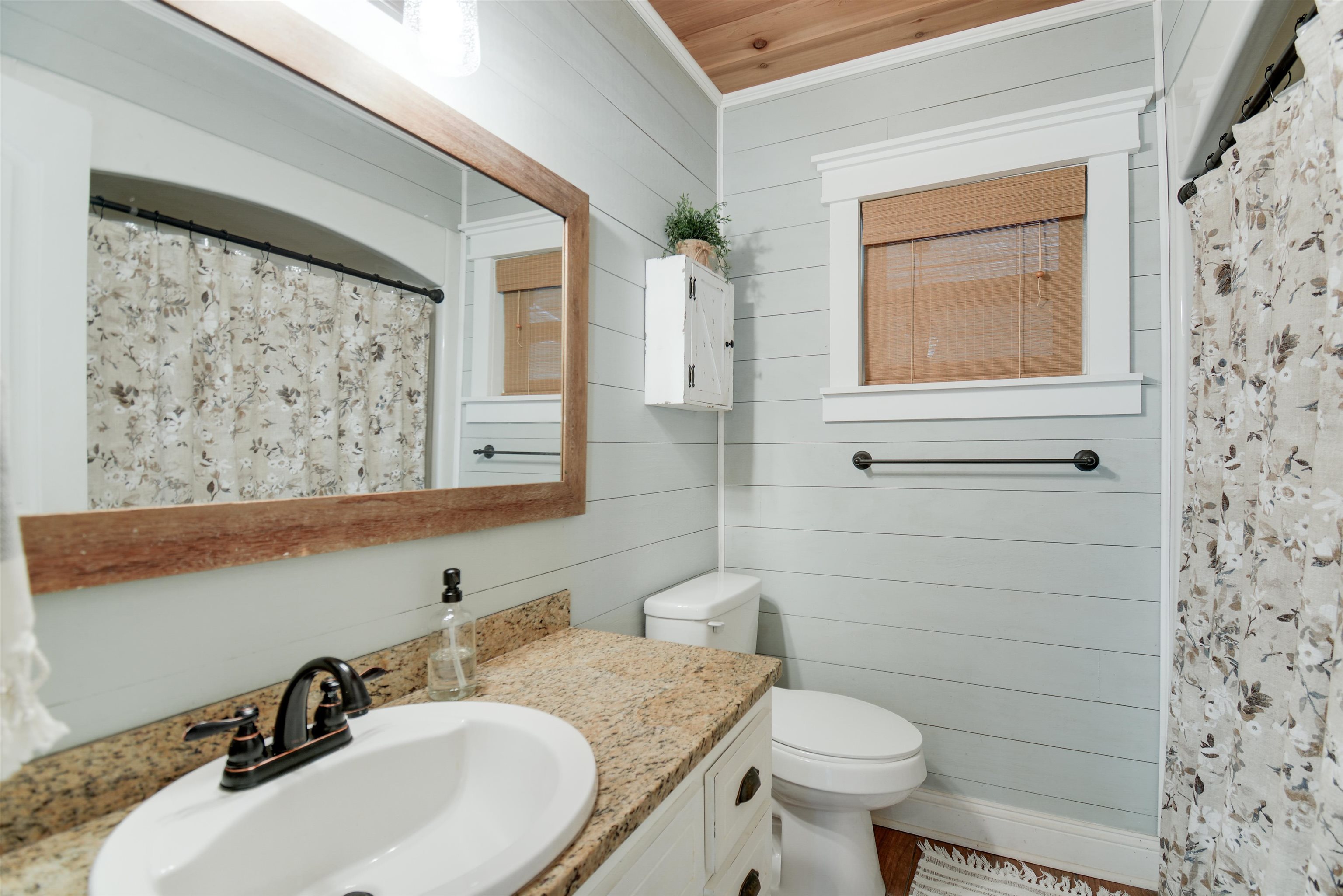 156 Egret Road St. Augustine, FL 32086 - Photo 13 of 44 a bathroom with a sink a toilet and shower curtain