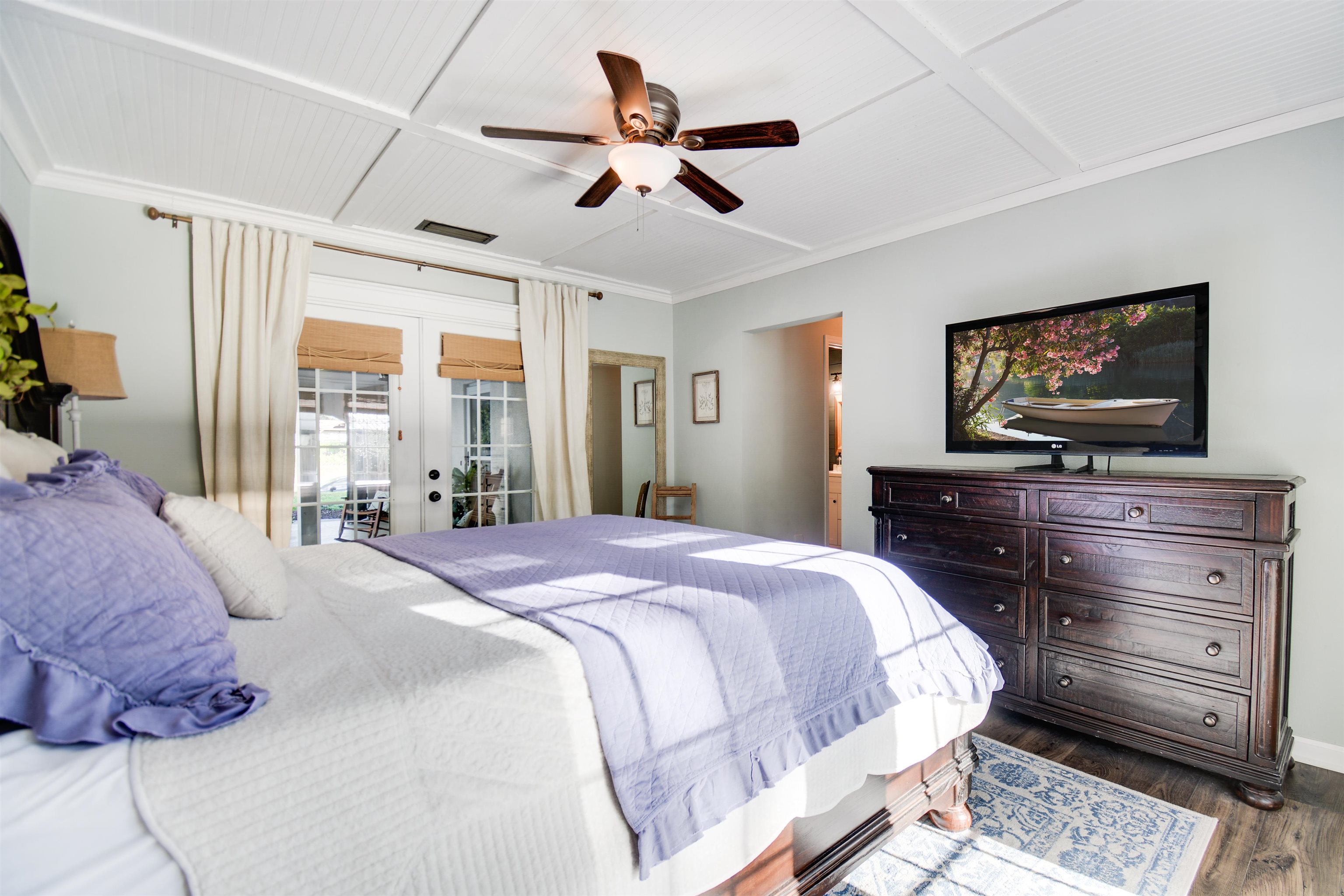 156 Egret Road St. Augustine, FL 32086 - Photo 21 of 44 a bedroom with a bed and a flat screen tv