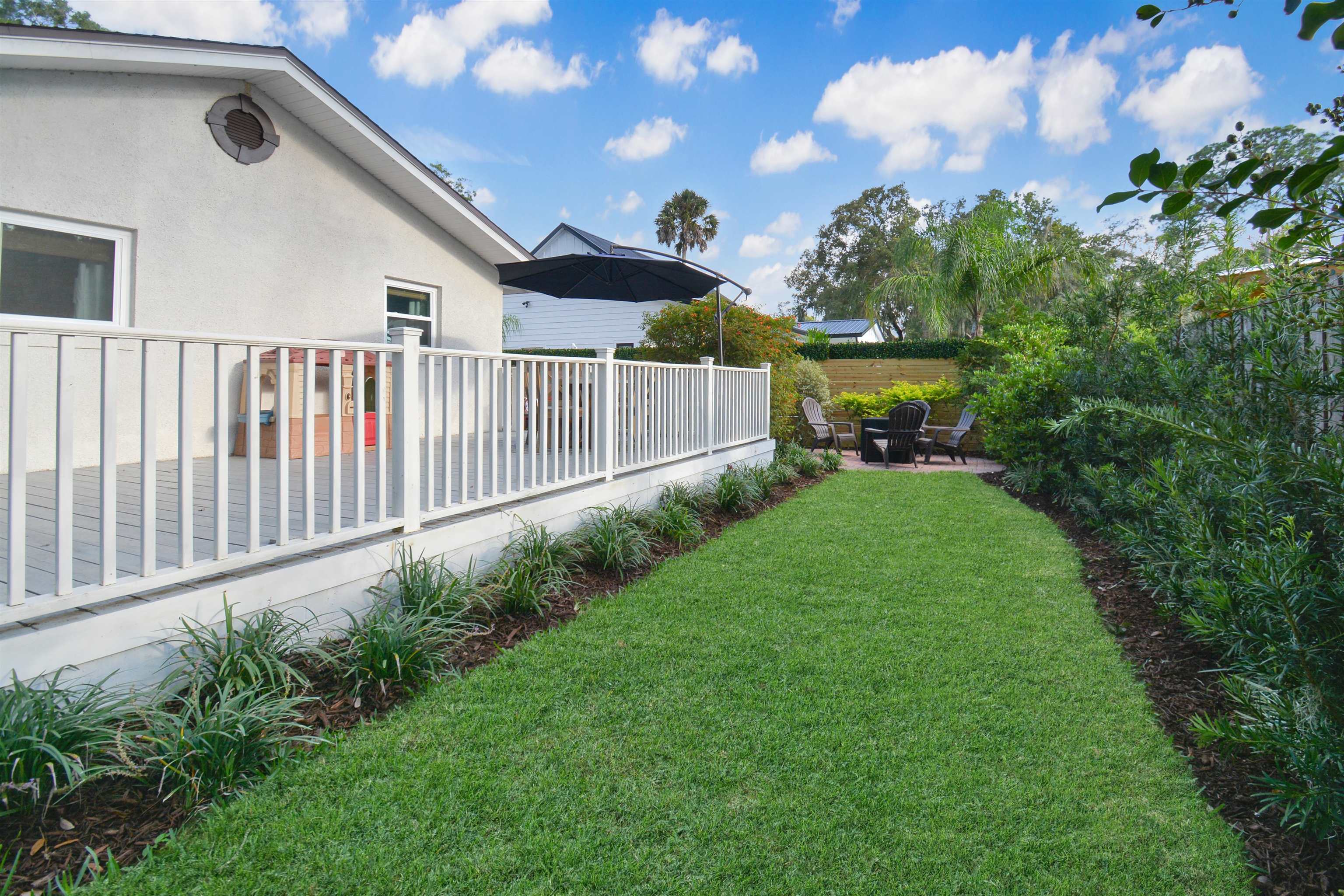 156 Egret Road St. Augustine, FL 32086 - Photo 26 of 44 a view of an house with backyard and garden