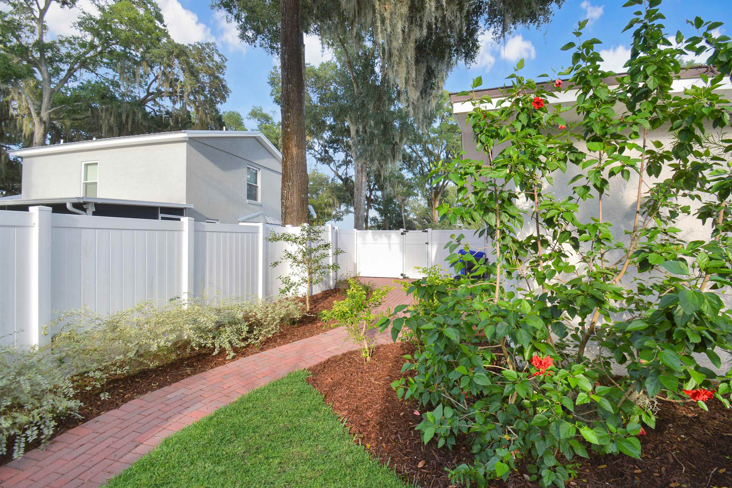 156 Egret Road St. Augustine, FL 32086 - Photo 28 of 44 a view of a garden with pathway