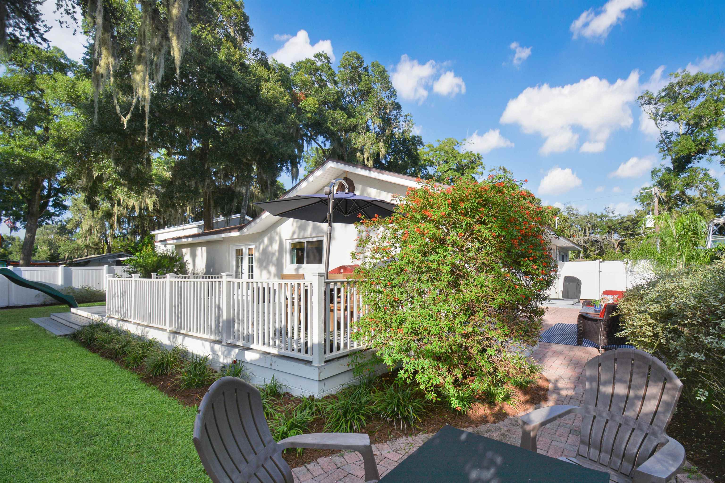 156 Egret Road St. Augustine, FL 32086 - Photo 32 of 44 a front view of a house with garden