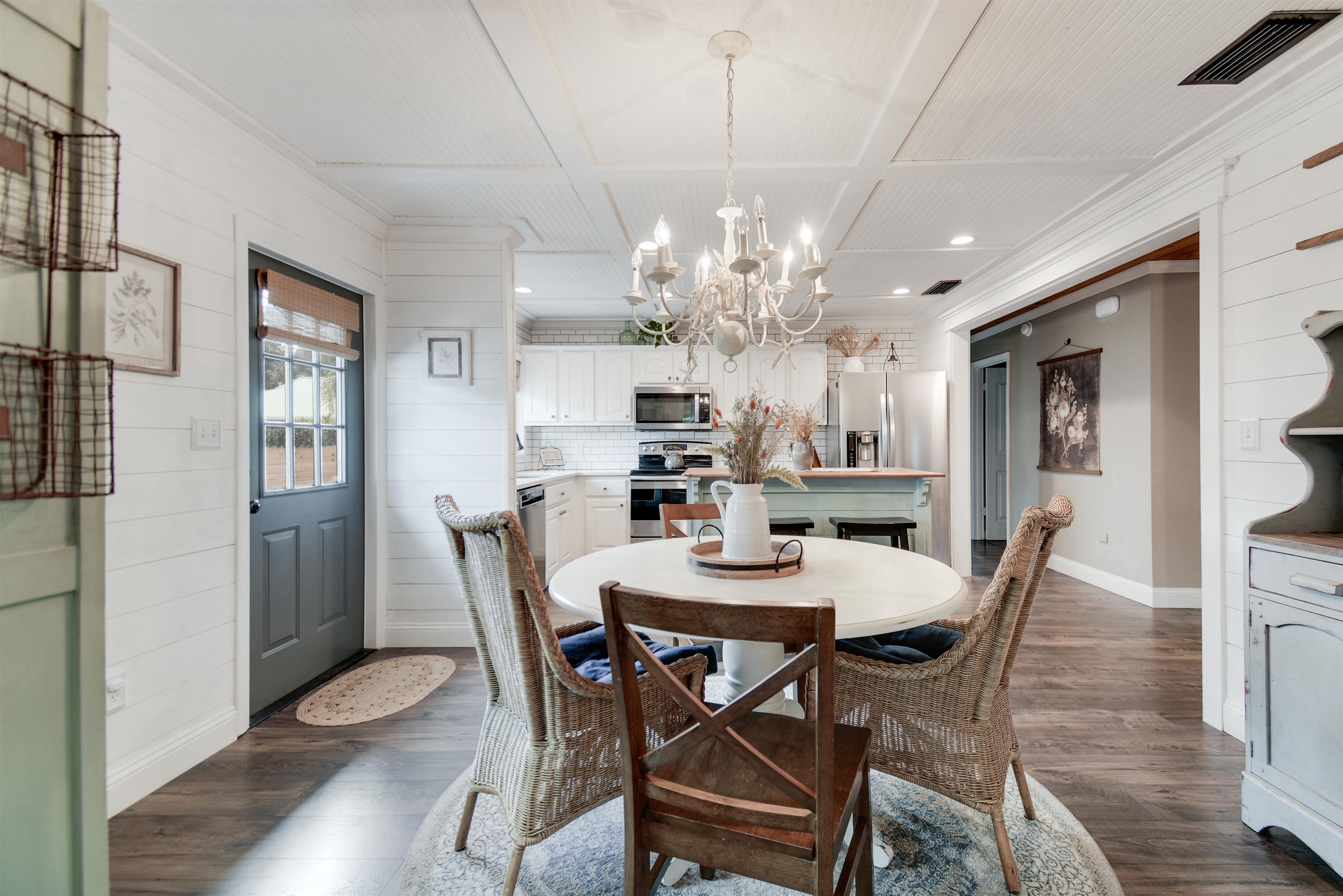 156 Egret Road St. Augustine, FL 32086 - Photo 8 of 44 a view of a dining room with furniture wooden floor and chandelier