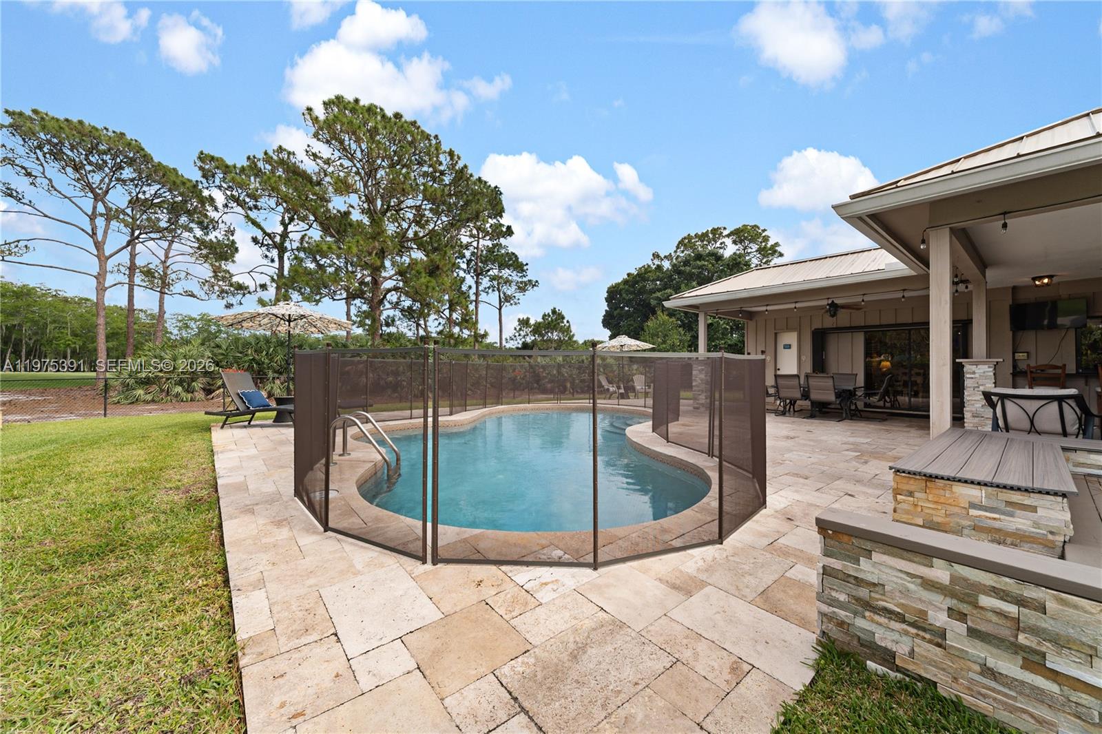 1872 Southeast Colony Way Jupiter, FL 33478 - Photo 21 of 26 a view of a swimming pool with a patio