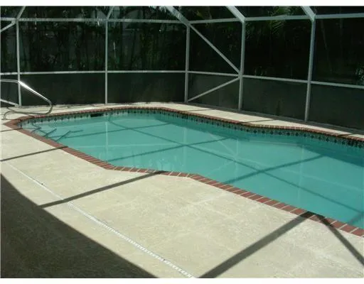 a kitchen with stainless steel appliances granite countertop a stove a refrigerator and a sink