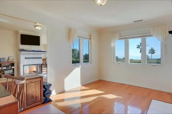 a bedroom with a large bed and a fireplace