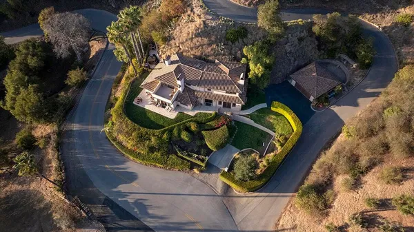 an aerial view of a house with a garden