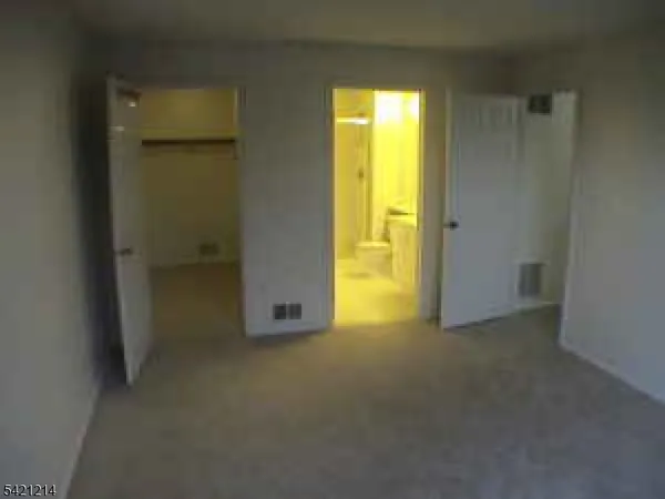 a view of empty room with painted walls