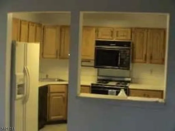 a kitchen with stainless steel appliances a stove and a refrigerator