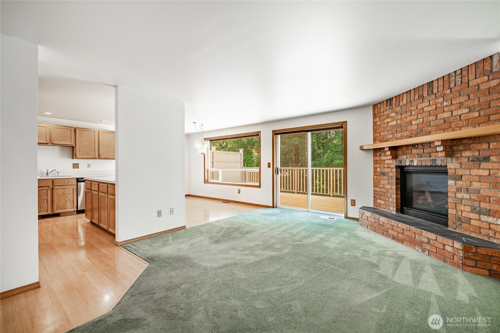 2104 Birch Circle Bellingham, WA 98229 - Photo 11 of 40 a view of an empty room with a fireplace and a window