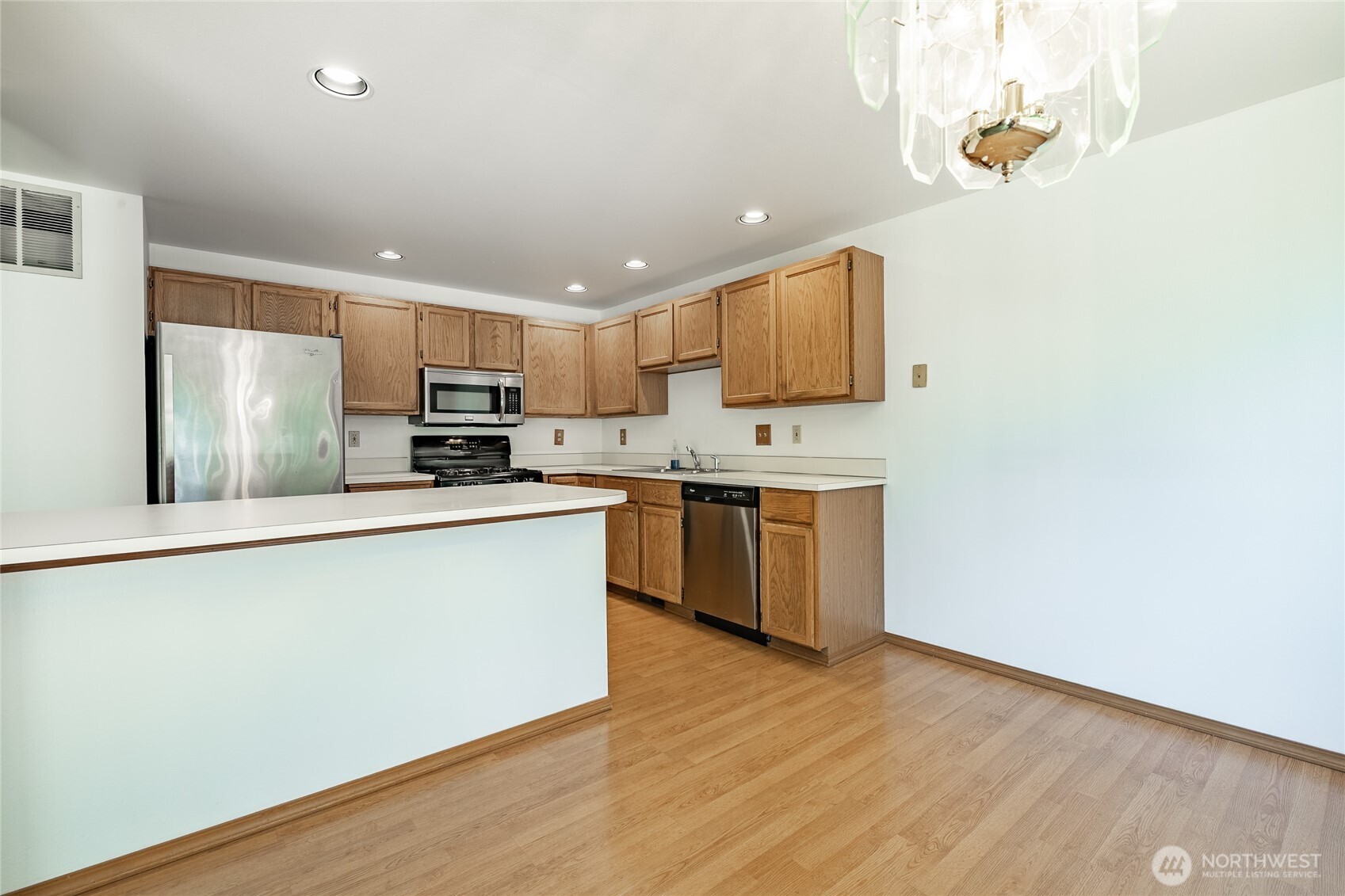 2104 Birch Circle Bellingham, WA 98229 - Photo 13 of 40 a kitchen with stainless steel appliances granite countertop a stove a sink and a refrigerator
