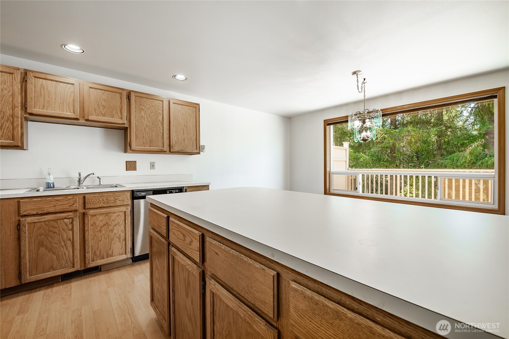 2104 Birch Circle Bellingham, WA 98229 - Photo 15 of 40 a kitchen with stainless steel appliances granite countertop a sink a stove and a refrigerator
