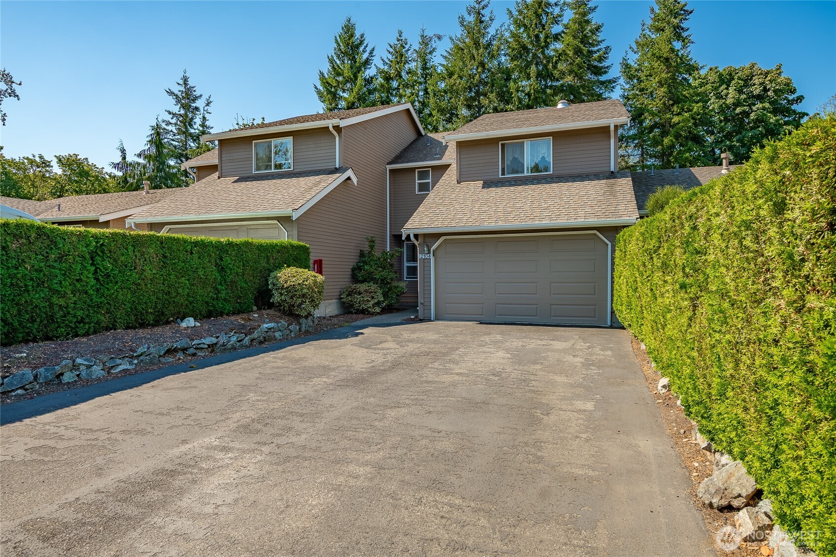 2104 Birch Circle Bellingham, WA 98229 - Photo 33 of 40 a front view of a house with a yard and garage