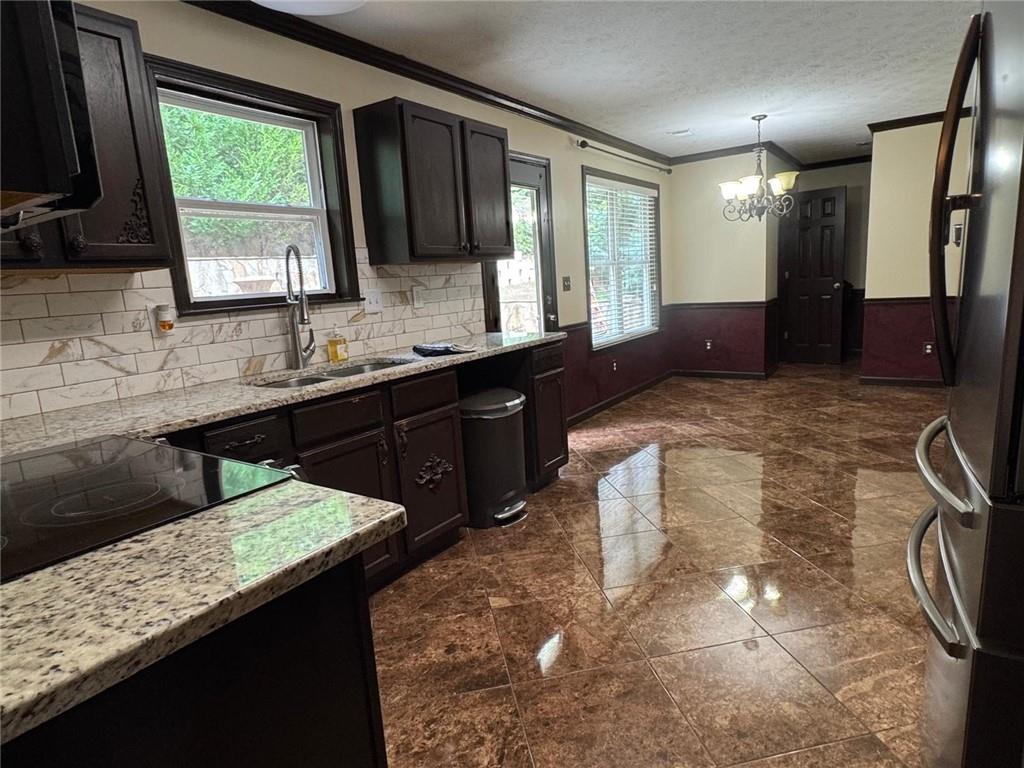 29 Lighthouse Drive Winder, GA 30680 - Photo 10 of 33 a bathroom with a granite countertop sink a mirror and a bathtub