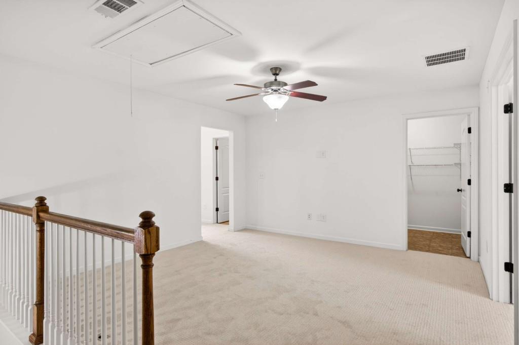 7631 Bucknell Terrace Fairburn, GA 30213 - Photo 18 of 43 a view of empty room with ceiling fan