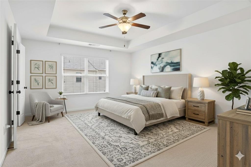 7631 Bucknell Terrace Fairburn, GA 30213 - Photo 20 of 43 a bedroom with a large bed and a window