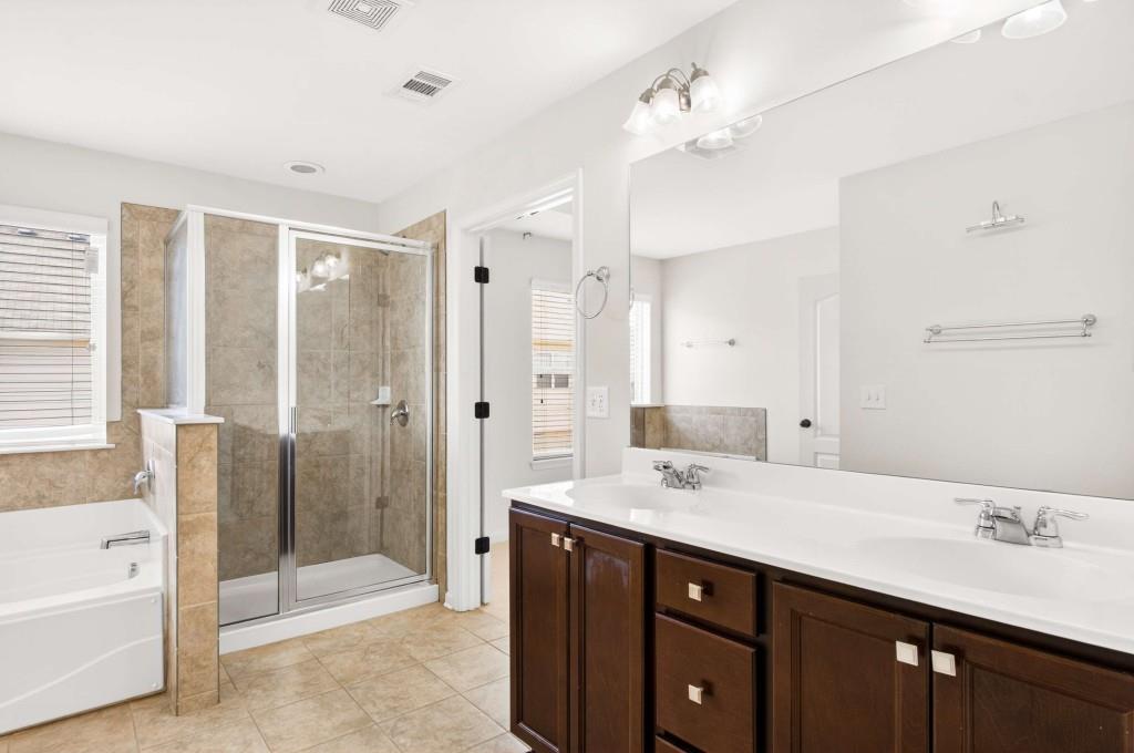 7631 Bucknell Terrace Fairburn, GA 30213 - Photo 23 of 43 a bathroom with a sink double vanity and a shower