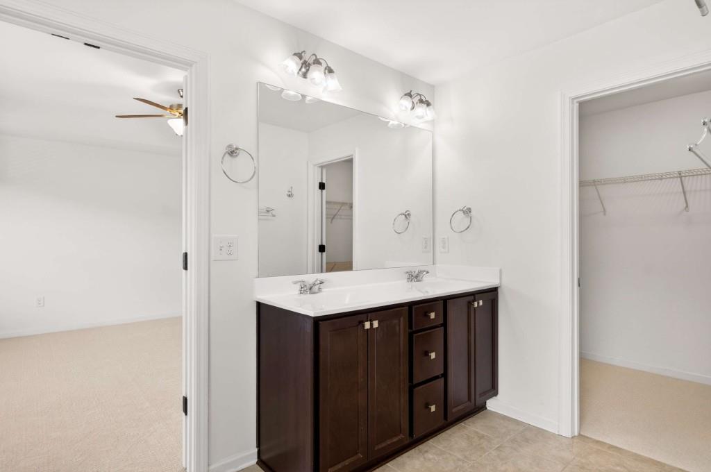7631 Bucknell Terrace Fairburn, GA 30213 - Photo 25 of 43 a spacious bathroom with a double vanity sink mirror and