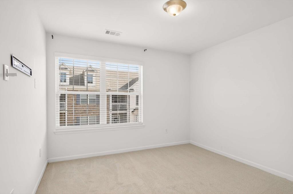 7631 Bucknell Terrace Fairburn, GA 30213 - Photo 29 of 43 an empty room with a window