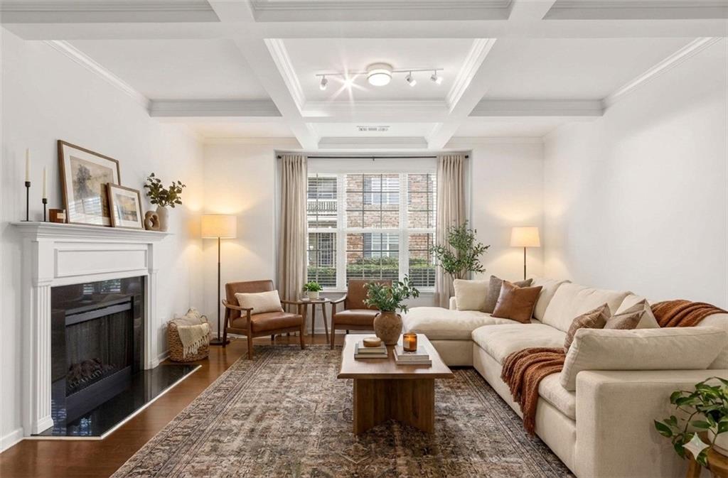 7631 Bucknell Terrace Fairburn, GA 30213 - Photo 4 of 43 a living room with furniture and a fireplace