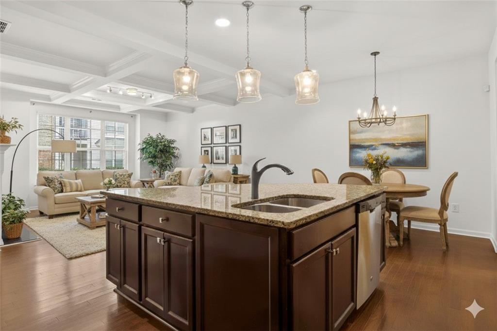 7631 Bucknell Terrace Fairburn, GA 30213 - Photo 10 of 43 a kitchen with stainless steel appliances granite countertop a sink a stove and a wooden floors