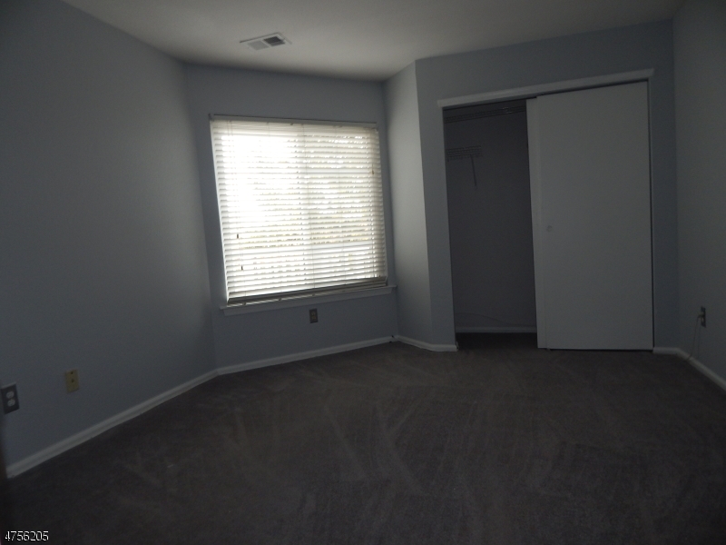 54 Wescott Road Bedminster, NJ 07921 - Photo 5 of 9 an empty room with a window